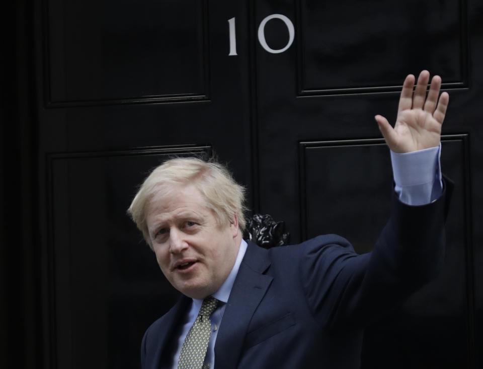 Britain's Prime Minister Boris Johnson returns to 10 Downing Street after meeting with Queen Elizabeth II at Buckingham Palace, London, on Friday, Dec. 13, 2019. Prime Minister Boris Johnson's Conservative Party has won a solid majority of seats in Britain's Parliament — a decisive outcome to a Brexit-dominated election that should allow Johnson to fulfil his plan to take the U.K. out of the European Union next month. (AP Photo/Matt Dunham)