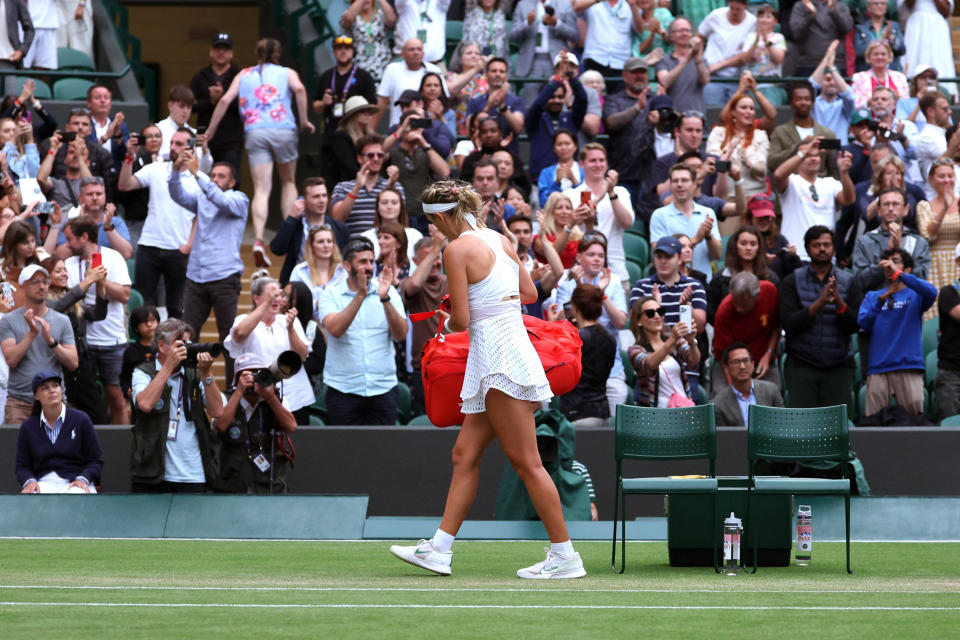 Victoria Azarenka leaves the court following her defeat against Elina Svitolina during the Wimbledon tennis championships in London (Patrick Smith / Getty Images)