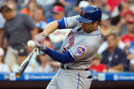 Aug 10, 2017; Philadelphia, PA, USA; New York Mets second baseman Neil Walker (20) breaks his bat while popping out against the Philadelphia Phillies during the first inning at Citizens Bank Park. Mandatory Credit: Bill Streicher-USA TODAY Sports