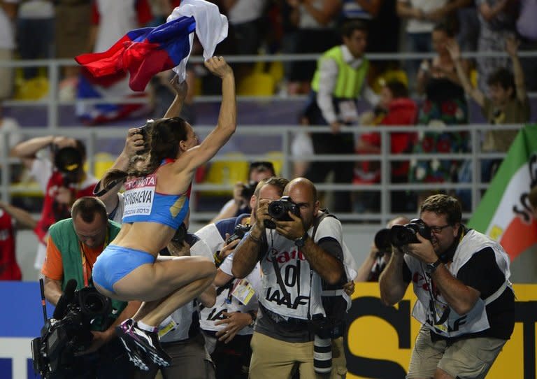 Russia's Yelena Isinbayeva celebrates after winning the women's pole vault final at the 2013 IAAF World Championships at the Luzhniki stadium in Moscow on August 13, 2013