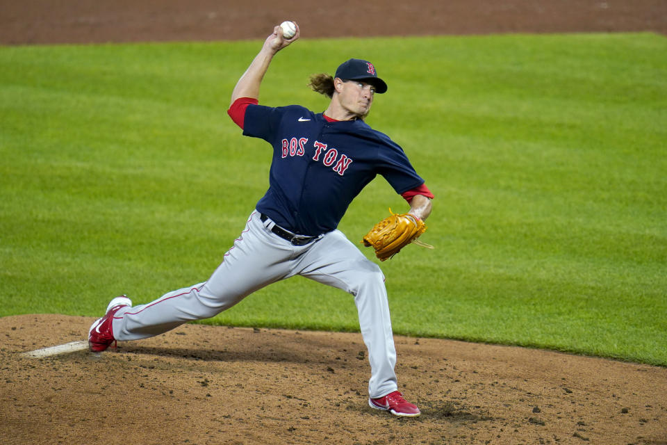 Boston Red Sox starting pitcher Garrett Richards throws a pitch to the Baltimore Orioles during the third inning of a baseball game, Saturday, April 10, 2021, in Baltimore. (AP Photo/Julio Cortez)