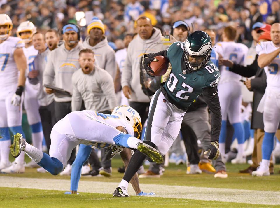 Nov 7, 2021; Philadelphia, Pennsylvania, USA; Philadelphia Eagles wide receiver John Hightower (82) is tackled by Los Angeles Chargers safety Nasir Adderley (24) at Lincoln Financial Field. Mandatory Credit: Eric Hartline-USA TODAY Sports