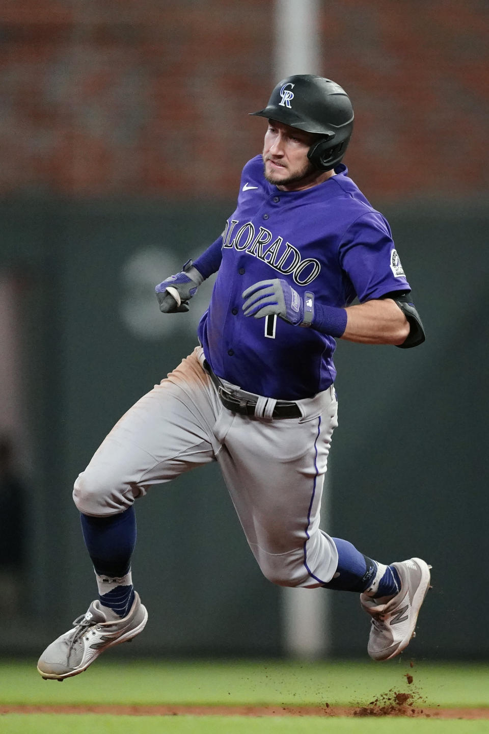 Colorado Rockies second baseman Garrett Hampson (1) rounds the bases on his way to a triple in the sixth inning of a baseball game against the Atlanta Braves Tuesday, Sept. 14, 2021, in Atlanta. (AP Photo/John Bazemore)