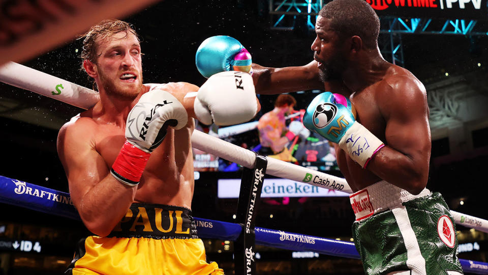 Logan Paul and Floyd Mayweather, pictured here exchanging blows at Hard Rock Stadium.