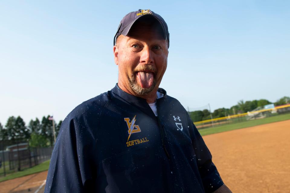 Littlestown head coach James Lovelace reacts after getting drenched by a water bottle bath following the Bolts' YAIAA softball championship win at Spring Grove Area School District on May 17, 2023. The Bolts defeated South Western, 1-0, in eight innings.