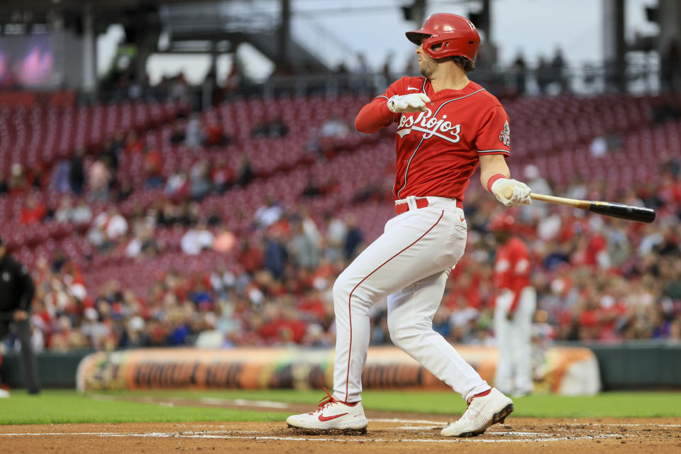 CORRECTS TO FIRST INNING NOT SECOND INNING - Cincinnati Reds' Kyle Farmer watches his two-run double during the first inning of a baseball game against the Milwaukee Brewers in Cincinnati, Friday, Sept. 23, 2022. (AP Photo/Aaron Doster)