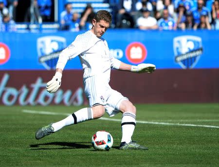 Apr 30, 2016; Montreal, Quebec, CAN; Colorado Rapids goalkeeper Zac MacMath (18) kicks the ballduring the first half against the Montreal Impact at Stade Saputo. Mandatory Credit: Eric Bolte-USA TODAY Sports