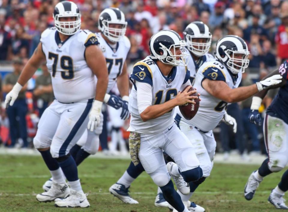Nov 12, 2017; Los Angeles, CA, USA; Los Angeles Rams quarterback Jared Goff (16) scrambles out of the pocket during the second half against the Houston Texans at Los Angeles Memorial Coliseum. Mandatory Credit: Robert Hanashiro-USA TODAY Sports