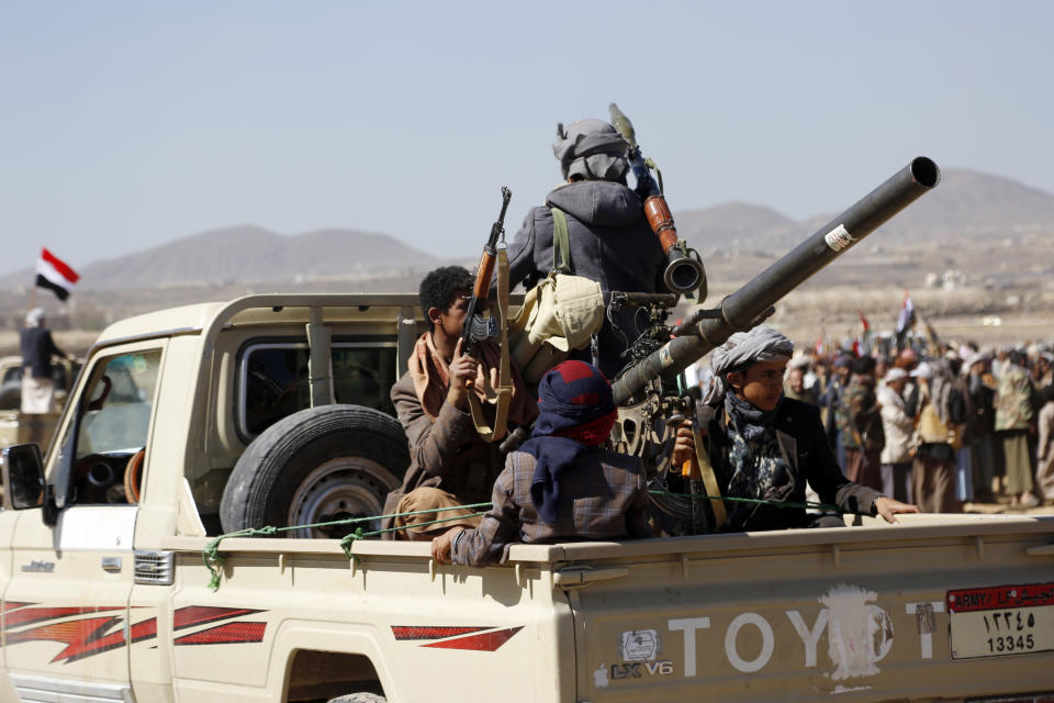 Houthi fighters and tribesmen stage a rally against the U.S. and the U.K. strikes on Houthi-run military sites near Sanaa, Yemen, on Sunday, Jan. 14, 2024. (AP Photo)