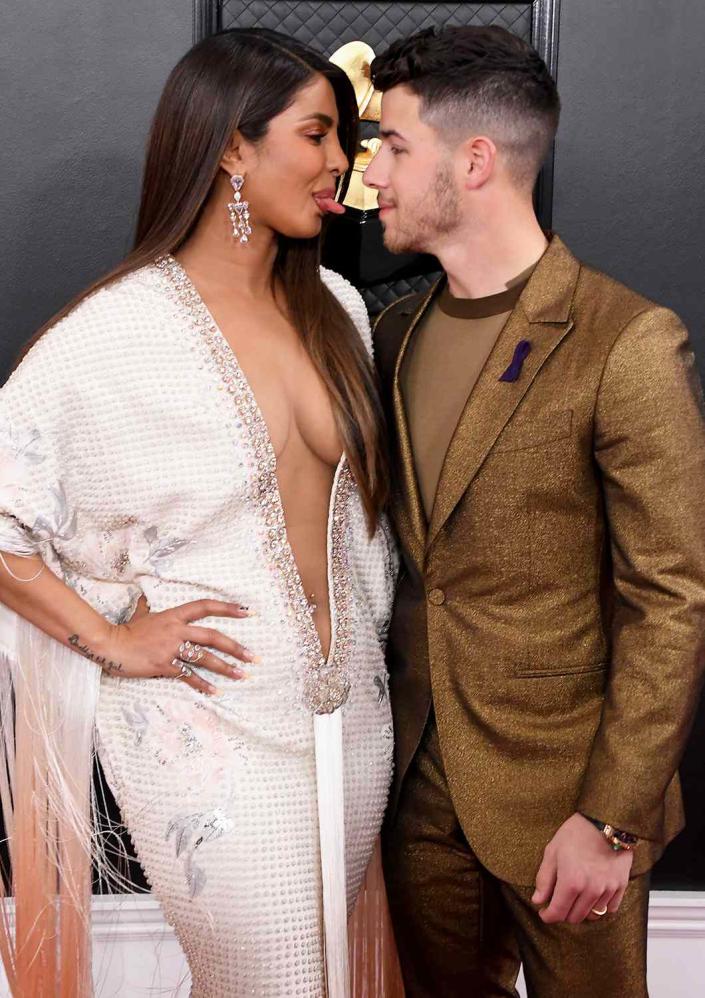 <p>Chopra playfully stuck her tongue out at Jonas as <a href="https://people.com/music/grammys-2020-couples-on-the-red-carpet/" rel="nofollow noopener" target="_blank" data-ylk="slk:they attended the Grammy Awards" class="link ">they attended the Grammy Awards</a> in January 2020. </p>