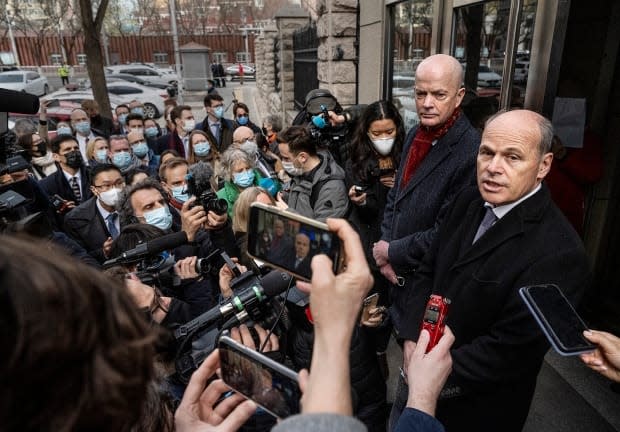 Canadian Embassy Charge d'Affaires Jim Nickel (R) and United States Embassy Acting Deputy Chief of Mission William Klein (2nd R) speak to media and supporting diplomats after they were denied entry to the closed trial for Canadian Michael Kovrig on March 22, 2021 in Beijing, China.