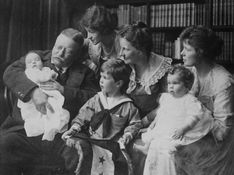 Theodore Roosevelt poses for a family portrait with his wife and children.