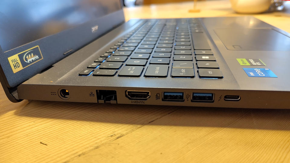 An Acer Aspire 7 sitting on a wooden desk