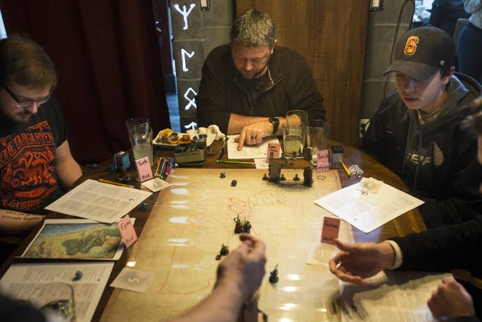 A small group plays "Dungeons and Dragons"