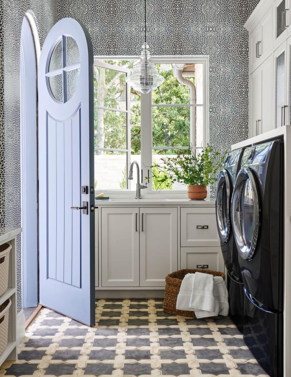 laundry room with blue door