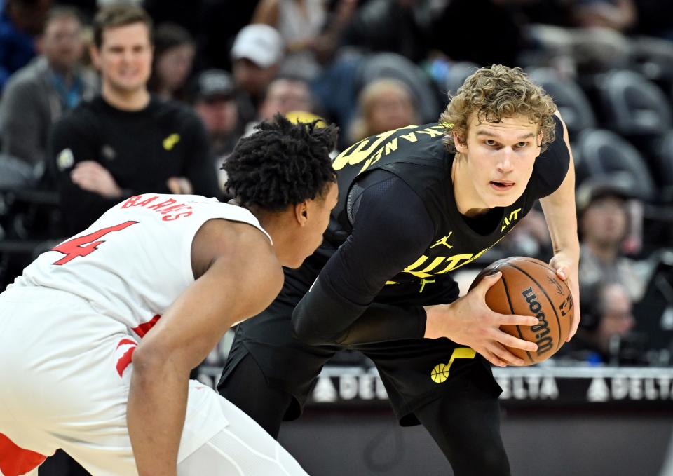 Utah Jazz forward Lauri Markkanen (23) looks past Toronto Raptors forward Scottie Barnes (4) for an open teammate as the Jazz and Raptors play at the Delta Center in Salt Lake City on Friday, Jan. 12, 2024. Utah won 145-113. | Scott G Winterton, Deseret News