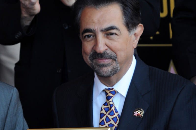 Joe Mantegna holds a replica plaque during an unveiling ceremony honoring him with the 2,438th star of the Hollywood Walk of Fame in Los Angeles in 2011. File Photo by Jim Ruymen/UPI