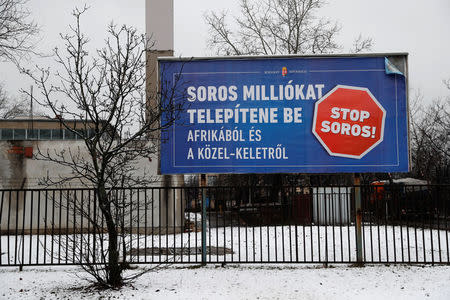 A government billboard is seen in Budapest, Hungary, February 14, 2018. A billboard reads: 'Soros wants to transplant millions from Africa and the Middle East'. REUTERS/Bernadett Szabo