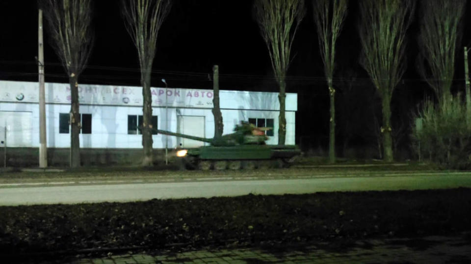 A screen grab captured from a video shows Russian military tanks advance in the Russian separatist-controlled part of the Donbas region.