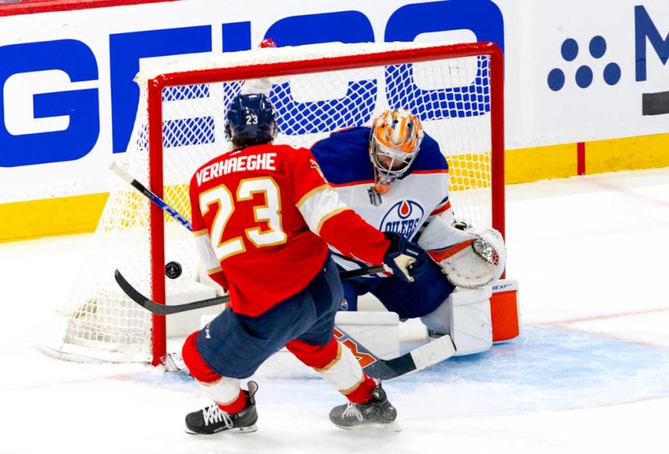 Florida Panthers center Carter Verhaeghe (23) shoots and scores as Edmonton Oilers goaltender Stuart Skinner defend during the first period of Game 1 of the NHL Stanley Cup Final at the Amerant Bank Arena on Saturday, June 8, 2024, in Sunrise, Fla.