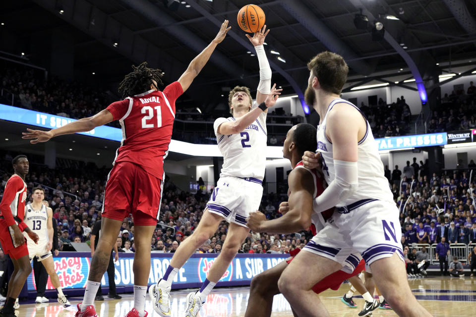 Northwestern forward Nick Martinelli (2) shoots over Ohio State forward Devin Royal (21) during the second half of an NCAA college basketball game in Evanston, Ill., Saturday, Jan. 27, 2024. (AP Photo/Nam Y. Huh)