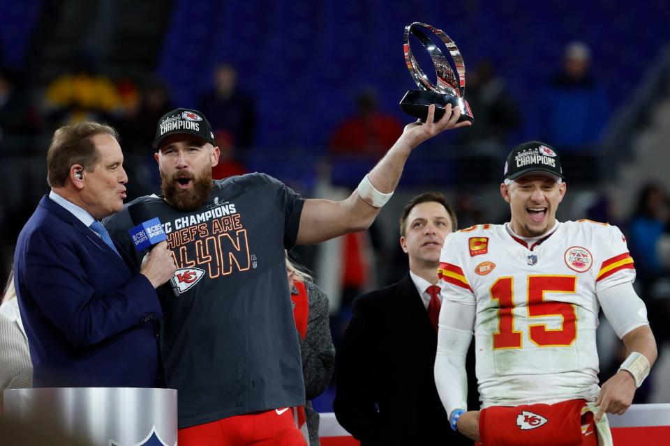 Chiefs tight end Travis Kelce holds the Lamar Hunt Trophy while speaking to CBS broadcaster Jim Nantz during the ceremony following the AFC championship game in Baltimore.