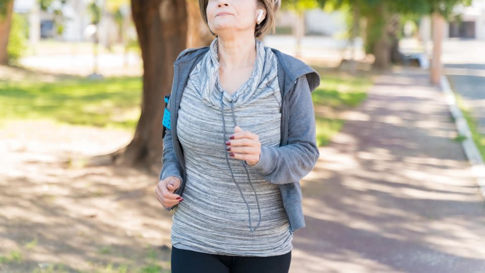 Incorporating breath work with a walking routine can increase the function of your breathing muscles so they won’t get tired as quickly. - Antonio_Diaz/iStockphoto/Getty Images