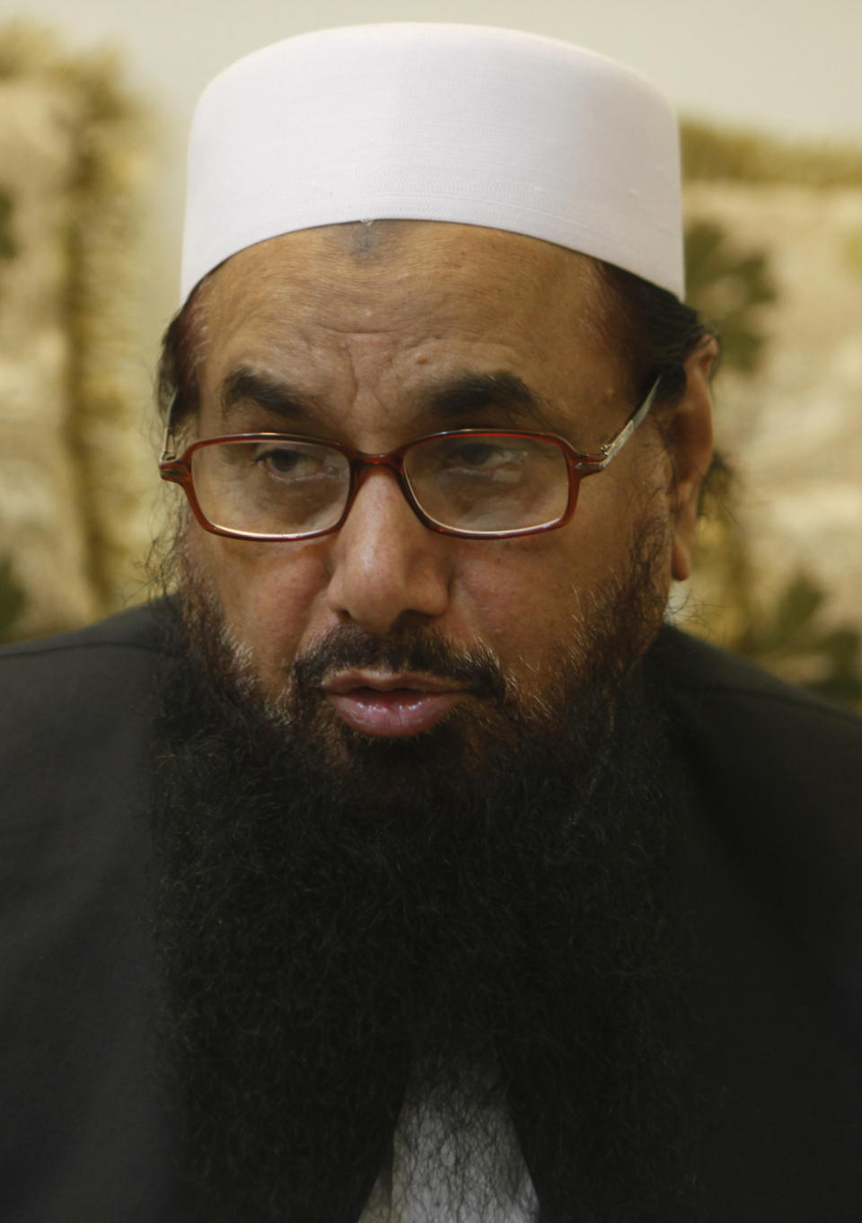 In this photo taken on July 13, 2016 in Lahore, Pakistan, Hafiz Saeed, a declared a terrorist by the United Nations and the United States, is leading the campaign for candidates of the radical Allah-o-Akbar Tehreek party after the Pakistan Election Commission refused to register his Mille Muslim League. Saeed also has a $10 million U.S.-imposed bounty on his head in connection with allegations he masterminded the 2008 attacks in Mumbai in India that killed 166 people. The Allah-o-Akbar Tehreek Party is fielding 260 candidates.Pakistan's parliamentary elections on July 25 will mark the second time a democratically elected government in this Islamic nation has been succeeded by another. (AP Photo/K.M. Chaudary