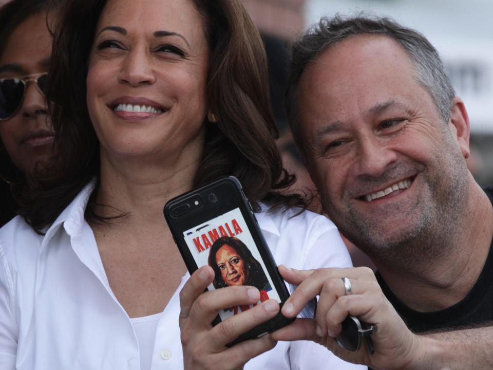 Doug Emhoff takes a selfie with Kamala Harris before her campaign speech.