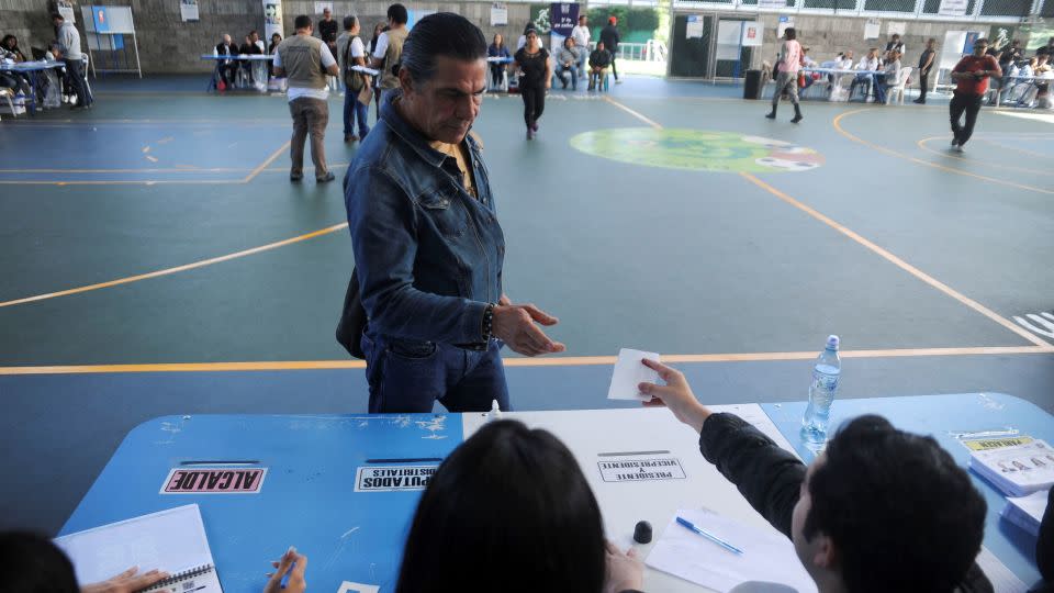 A voter casts their ballot at a polling station during the presidential run-off election in Guatemala City, Guatemala, on August 20, 2023. - Cristina Chiquin/Reuters