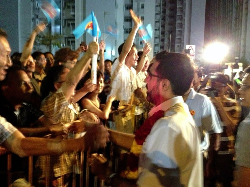 Aljunied MP Pritam Singh greets party supporters at its last rally in Punggol East. (Yahoo! photo)