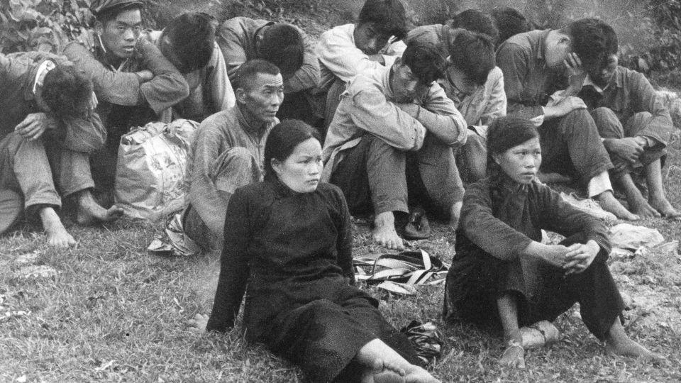 People escaping famine in mainland China were detained by Hong Kong police and British troops after crossing the border into the city in May 1962. - AP