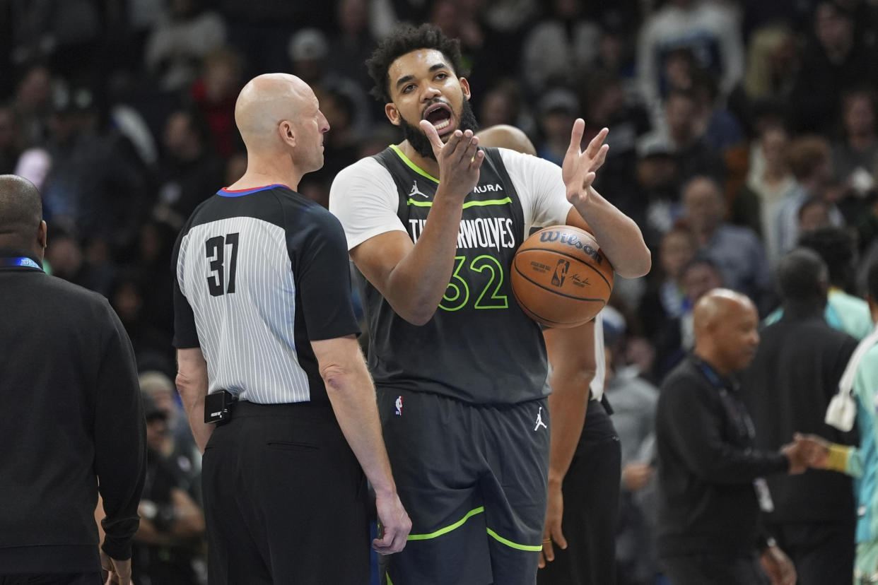 Karl-Anthony Towns pleads his case with referee Eric Dalen to no avail. (AP Photo/Abbie Parr)