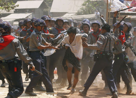 Police hit a student protester during violence in Letpadan, Myanmar, March 10, 2015. REUTERS/Soe Zeya Tun