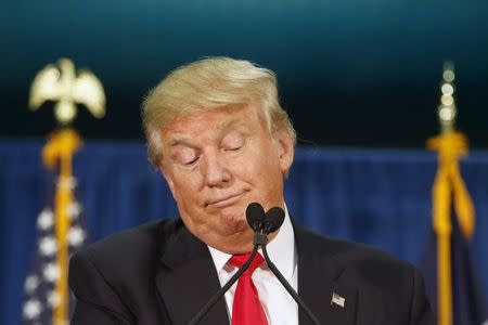 U.S. Republican presidential candidate Donald Trump stops speaking while waiting for protesters to be removed at a campaign rally at the University of Iowa in Iowa City, Iowa, January 26, 2016. REUTERS/Scott Morgan