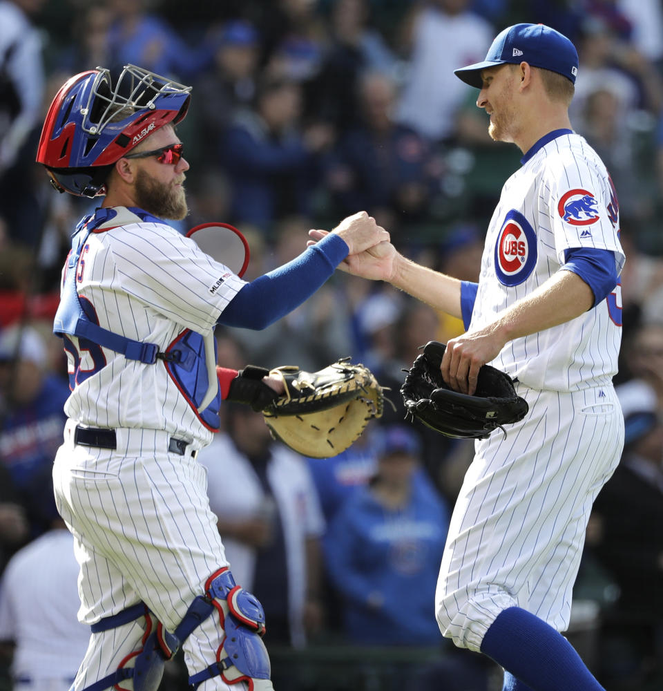 Chicago Cubs relief pitcher Mike Montgomery, right, celebrates with catcher Taylor Davis after the Cubs defeated the Miami Marlins 4-1 in a baseball game Thursday, May 9, 2019, in Chicago. (AP Photo/Nam Y. Huh)