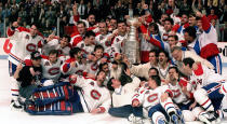 FILE - The Montreal Canadiens pose for a photograph with the Stanley Cup following their 4-1 victory over the Los Angeles Kings in Montreal, in this June 9, 1993, file photo. Patrick Roy is at front left lying down. The Montreal Canadiens bid to end Canada's Stanley Cup drought brings back memories of the building in which they last won the title in 1993. The Montreal Forum still stands, but it's significance is beginning to fade. (Frank Gunn/The Canadian Press via AP, File)