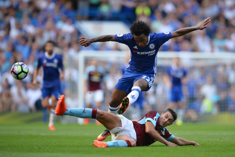 Chelsea's Brazilian midfielder Willian, pictured jumping a tackle on August 27, 2016, doubled the lead before half-time, as Chelsea produced their first clean sheet of the season