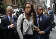 Former Baltimore Ravens NFL running back Ray Rice (R) and his wife Janay arrive for a hearing at a New York City office building, in this November 5, 2014 file photo. REUTERS/Mike Segar/Files (UNITED STATES - Tags: SPORT CRIME LAW FOOTBALL TPX IMAGES OF THE DAY)