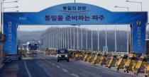 Vehicles cross the Tongil bridge leading away from the Kaesong joint industrial area and the Demilitarized Zone (DMZ) between the two Koreas, in Paju, on February 10, 2016