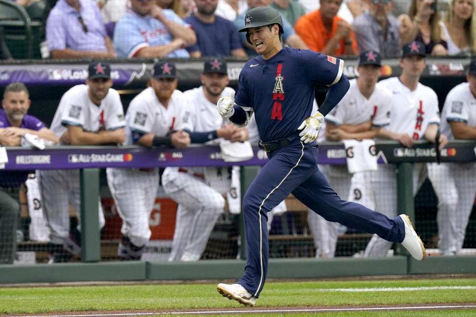 American League's Shohei Ohtani, of the Los Angeles Angeles, runs out his ground out during the first inning of the MLB All-Star baseball game, Tuesday, July 13, 2021, in Denver. (AP Photo/Gabriel Christus)