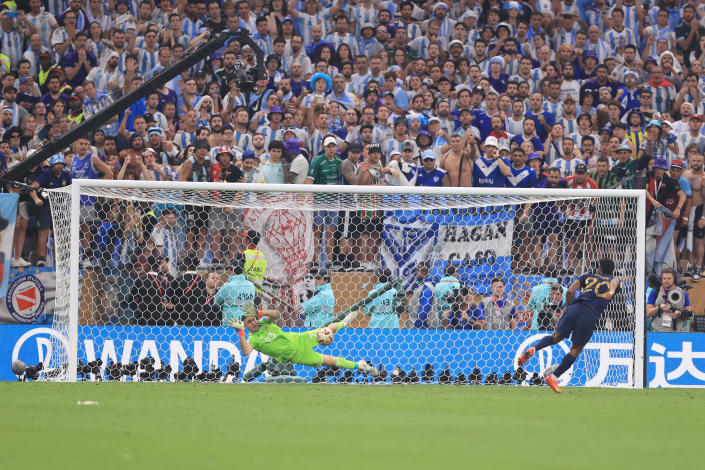 LUSAIL CITY, QATAR - DECEMBER 18: Argentina goalkeeper Emiliano Martinez saves the penalty from Kingsley Coman of France in the shoot-out during the FIFA World Cup Qatar 2022 Final match between Argentina and France at Lusail Stadium on December 18, 2022 in Lusail City, Qatar. (Photo by Simon Stacpoole/Offside/Offside via Getty Images)