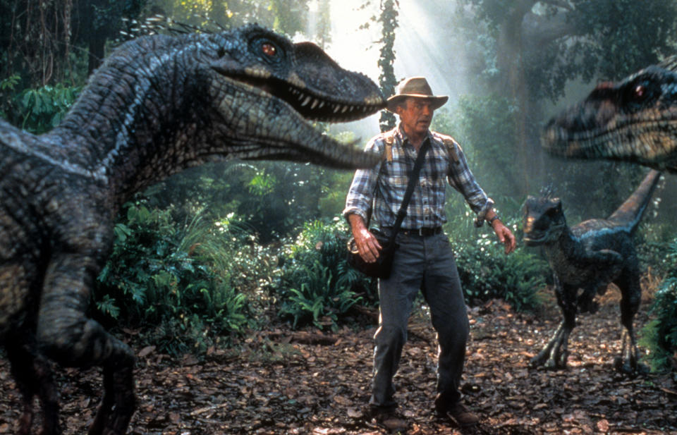 Sam Neill is confronted by three dinosaurs in a scene from the film 'Jurassic Park III', 2001. (Photo by Universal/Getty Images)