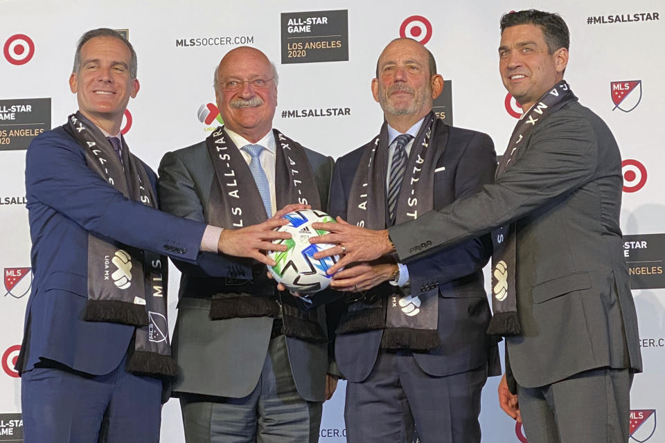 Los Angeles mayor Eric Garcetti, from left, LIGA MX Executive President Enrique Bonilla, Major League Soccer Commissioner Don Garber and LAFC President Tom Penn announce that the MLS 2020 All-Star soccer game will be held in Los Angeles, during a press conference at Banc of California Stadium in Los Angeles, Wednesday, Nov 20, 2019. The game, which will be held on July 29, 2020, will match the best of MLS against the all stars from Mexico's LIGA MX. (AP photo/Joe Reedy)