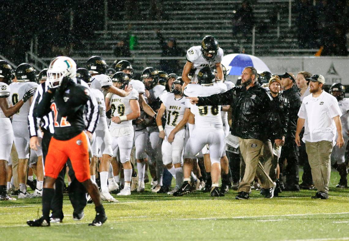 The visiting Boyle County football team celebrates after beating Frederick Douglass 34-7 in Lexington last October.