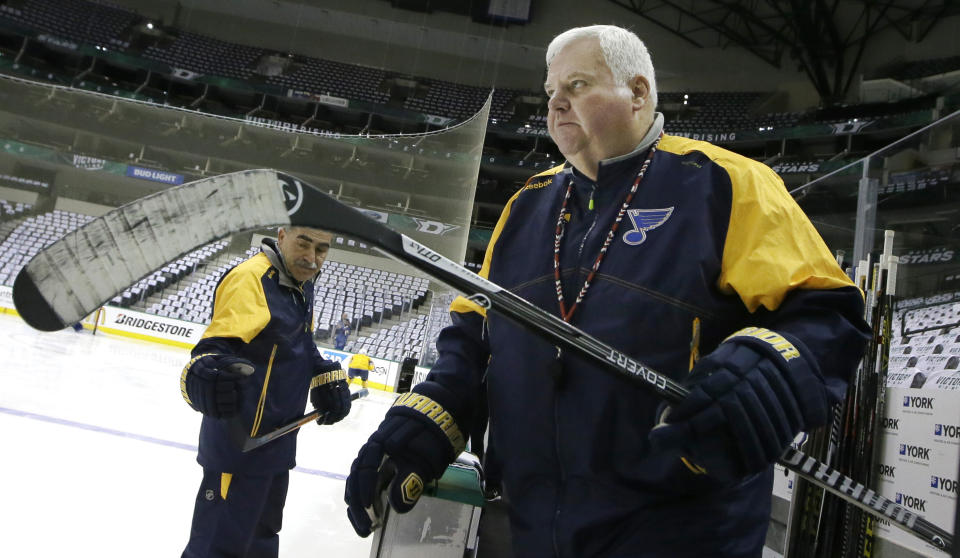 FILE - In this April 30, 2016, file photo, St. Louis Blues head coach Ken Hitchcock takes the ice for practice in preparation of Game 2 of the NHL hockey Stanley Cup Western Conference semifinals, in Dallas. The Edmonton Oilers have fired coach Todd McLellan and replaced him with Ken Hitchcock with the team languishing in sixth place in the Pacific Division. McLellan was in his fourth season behind the Oilers' bench. The team missed the playoffs in two of his previous three seasons despite having superstar Connor McDavid on its roster. The Oilers were just 9-10-1 entering its game Tuesday night, Nov. 20, 2018, at San Jose. (AP Photo/LM Otero, File)