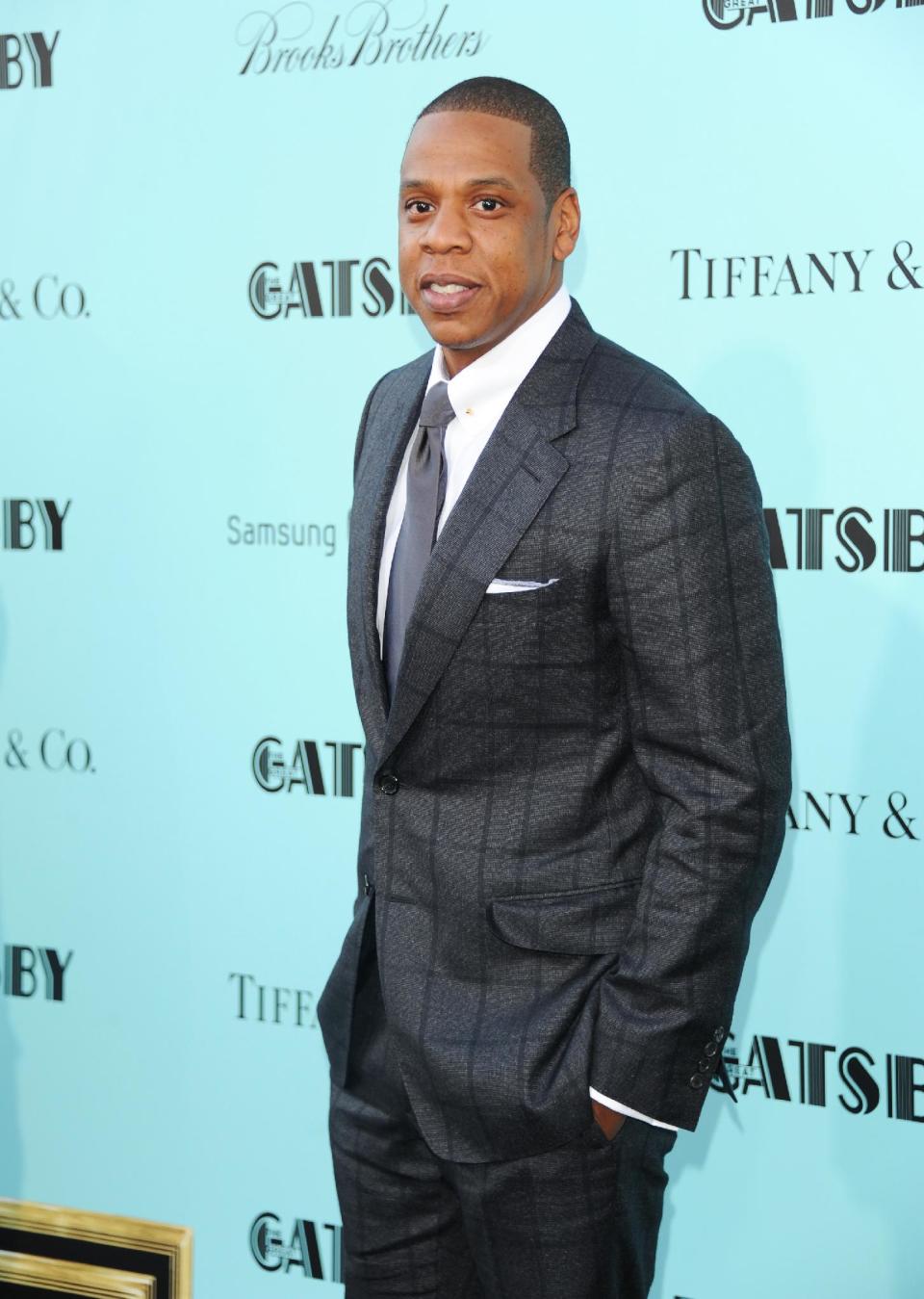 FILE - In this May 1, 2013 file photo, Jay-Z attends "The Great Gatsby" world premiere at Avery Fisher Hall in New York. If there is a lesson to take away from attending Jay Z's super-exclusive pre-Grammy party, it's simple — don't come late.Some guests learned the hard way Saturday Jan. 25, 2014, when they were left on the outside looking in at the palatial mansion where the rapper's annual Roc Nation brunch was held. (Photo by Evan Agostini/Invision/AP, File)