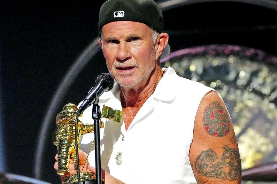 NEWARK, NEW JERSEY - AUGUST 28: Chad Smith of Red Hot Chili Peppers accept the Global Icon award onstage at the 2022 MTV VMAs at Prudential Center on August 28, 2022 in Newark, New Jersey. (Photo by Jeff Kravitz/Getty Images for MTV/Paramount Global)