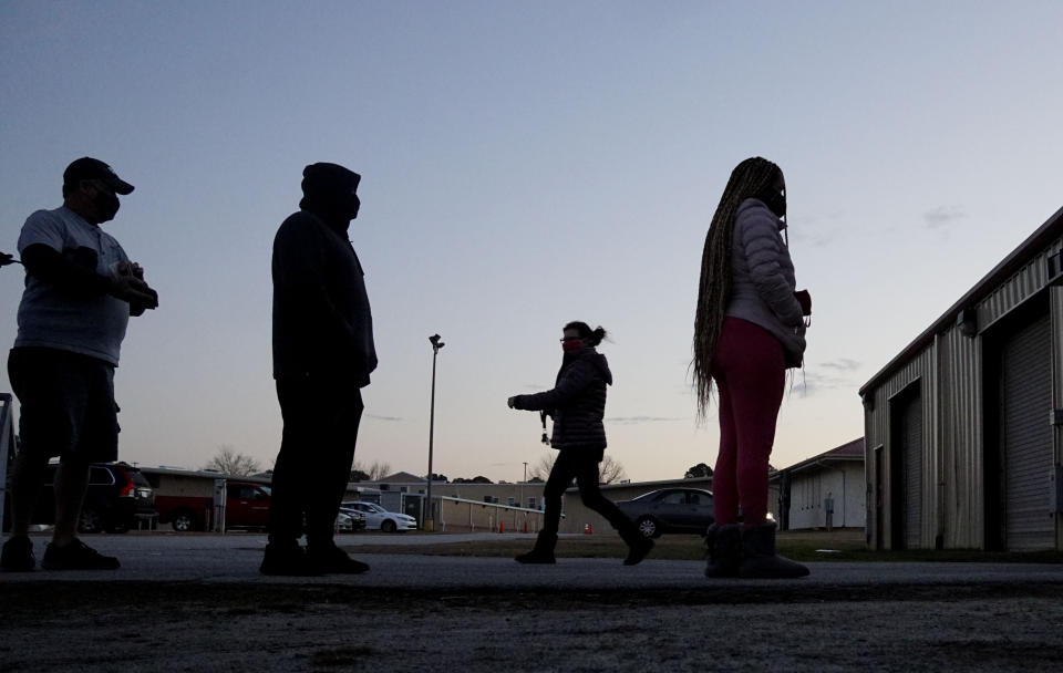 Voters stand in line at a polling station at the Gwinnett County Fairgrounds on Jan. 5, 2021, in Lawrenceville, Georgia.  (Photo: SANDY HUFFAKER via Getty Images)