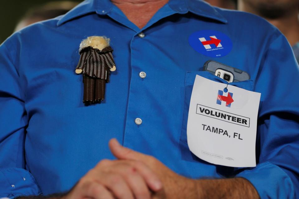 Larry Potter, Clinton volunteer wears a Hillary Clinton doll on his shirt at a campaign Voter Registration Rally at the University of South Florida in Tampa, Florida on September 6, 2016. (Photo: Brian Snyder/Reuters)